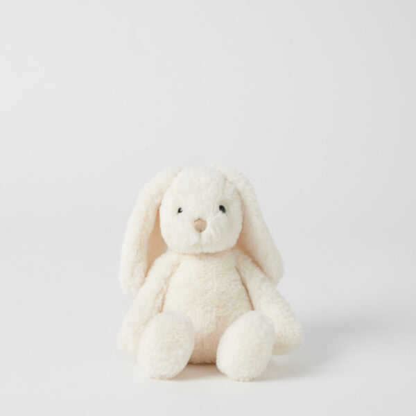 White plush bunny toy on a light gray background