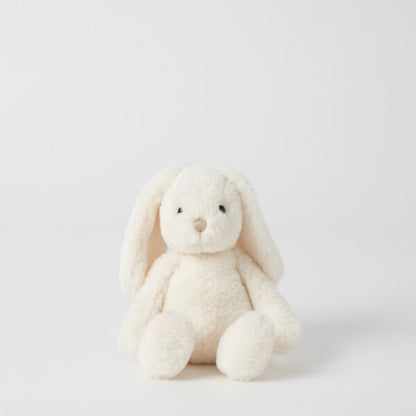 White plush bunny toy on a light gray background