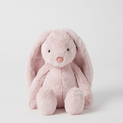 Pink plush bunny toy on a white background