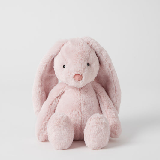 Pink plush bunny toy on a white background