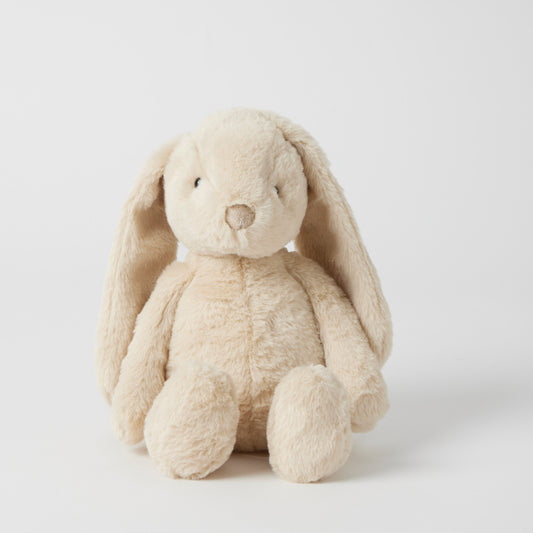Beige plush bunny toy on a light gray background