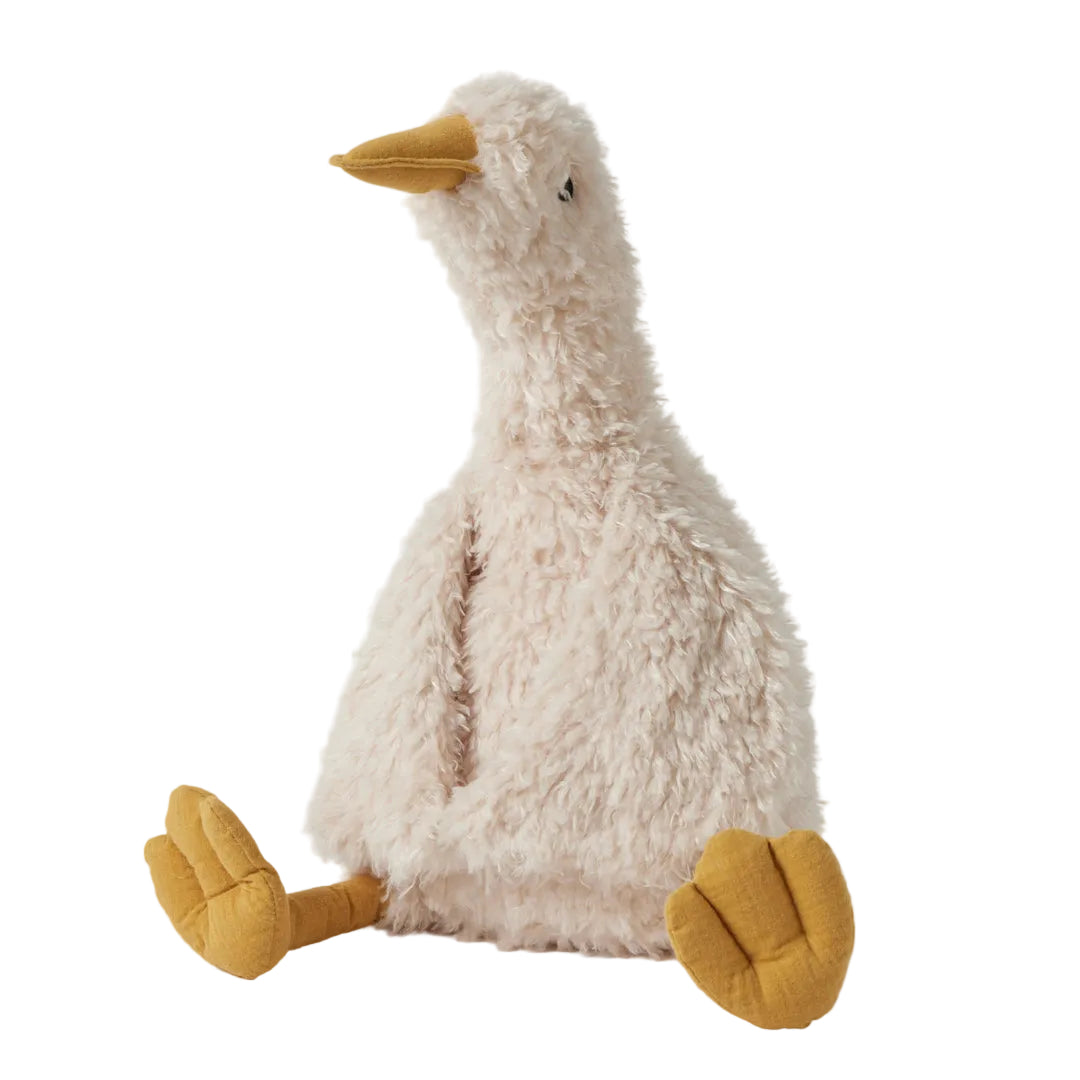 Plush toy goose with yellow feet and beak on a white background