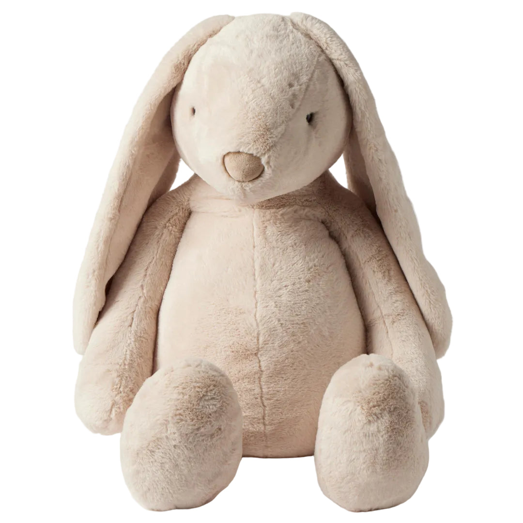 Beige plush bunny toy on a light gray background