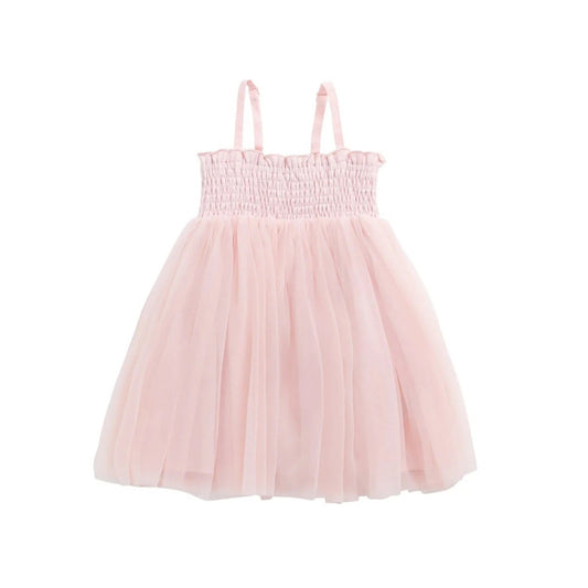 Pink dress with smocked bodice and tulle skirt on a white background