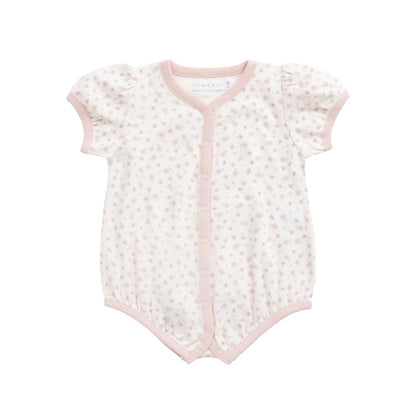 Baby romper with floral pattern on a white background