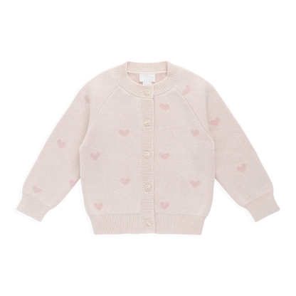 Light pink cardigan with heart patterns on a white background