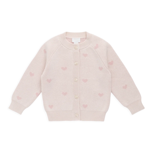 Light pink cardigan with heart patterns on a white background