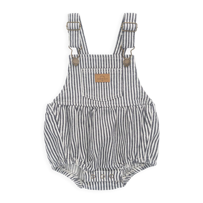 Striped baby romper with suspenders on a white background