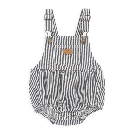 Striped baby romper with suspenders on a white background