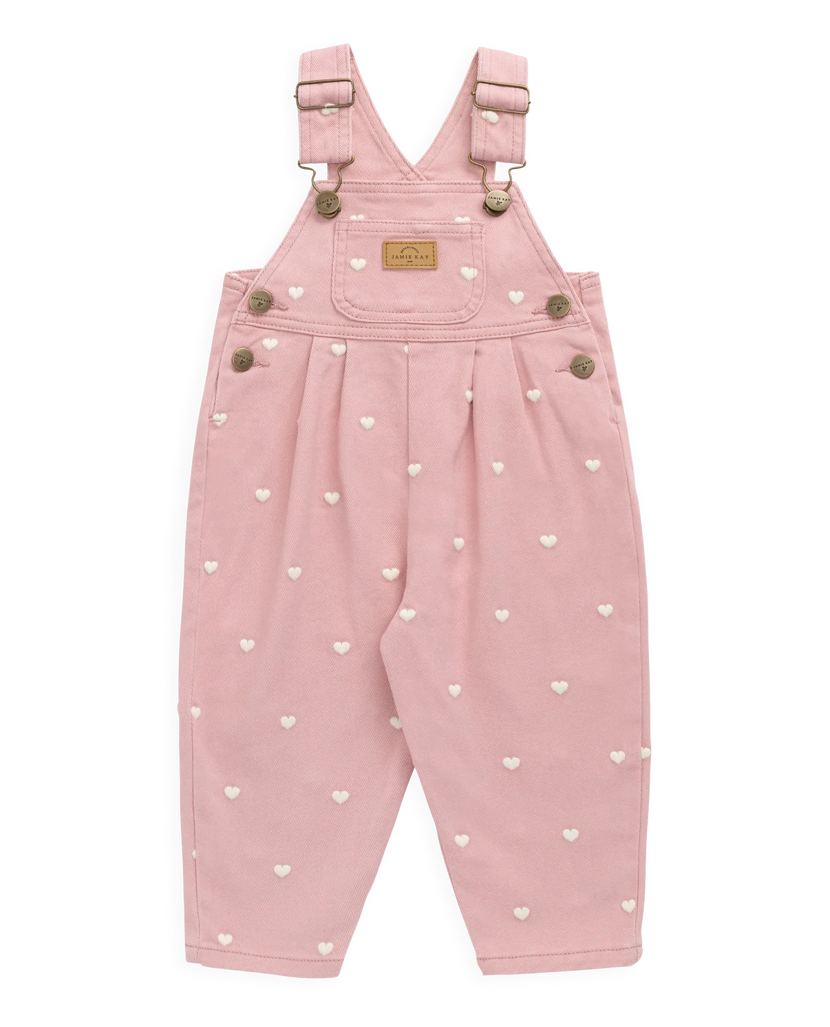 Pink children's dungarees with heart patterns on a white background