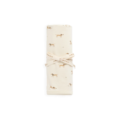 Folded fabric with small dog pattern on a white background