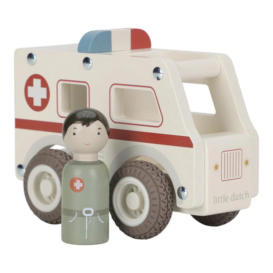 Wooden toy ambulance with a matching figurine on a white background