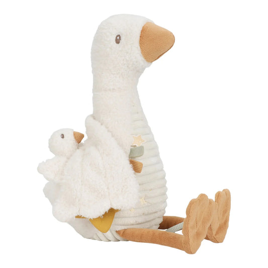 Stuffed toy goose with a smaller goose on its back on a white background