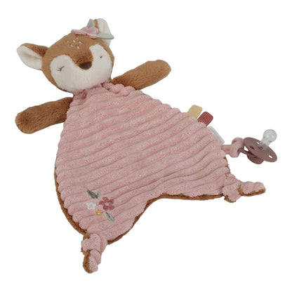 Plush toy fox with pink blanket and pacifier on a white background