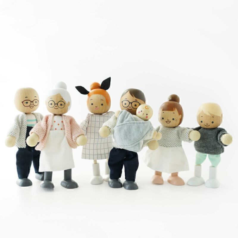 Set of toy figures dressed in casual clothing on a white background