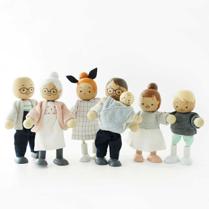 Set of toy figures dressed in casual clothing on a white background