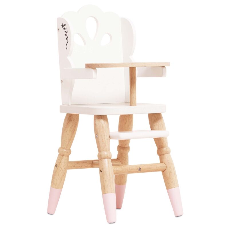 Wooden high chair with pink accents on a white background