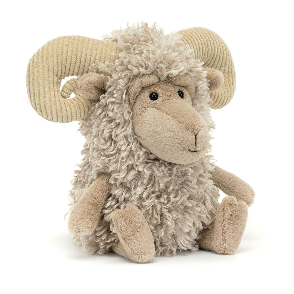 Stuffed toy ram with curly wool on a white background