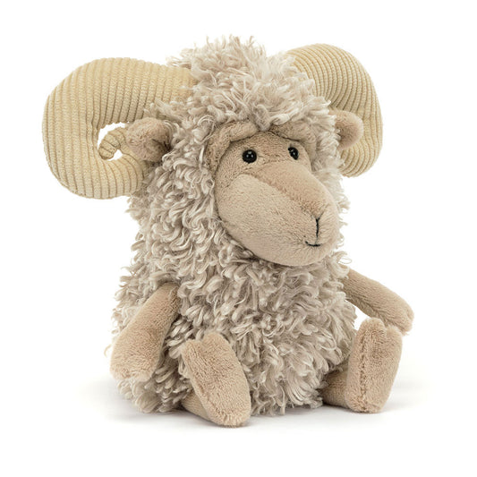 Stuffed toy ram with curly wool on a white background