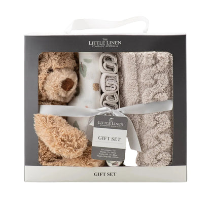Gift set with plush toys and blankets in a Little Linen packaging on a light gray background