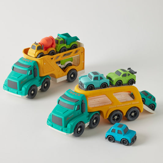 Toy trucks and cars set on a light gray background