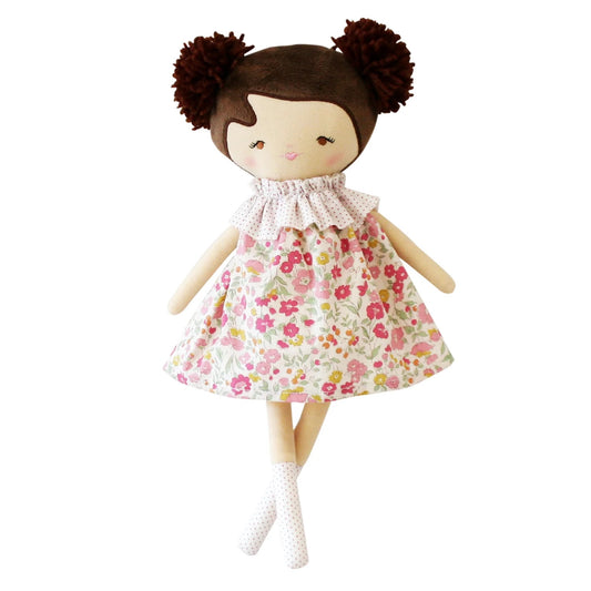 Doll with a floral dress on a white background