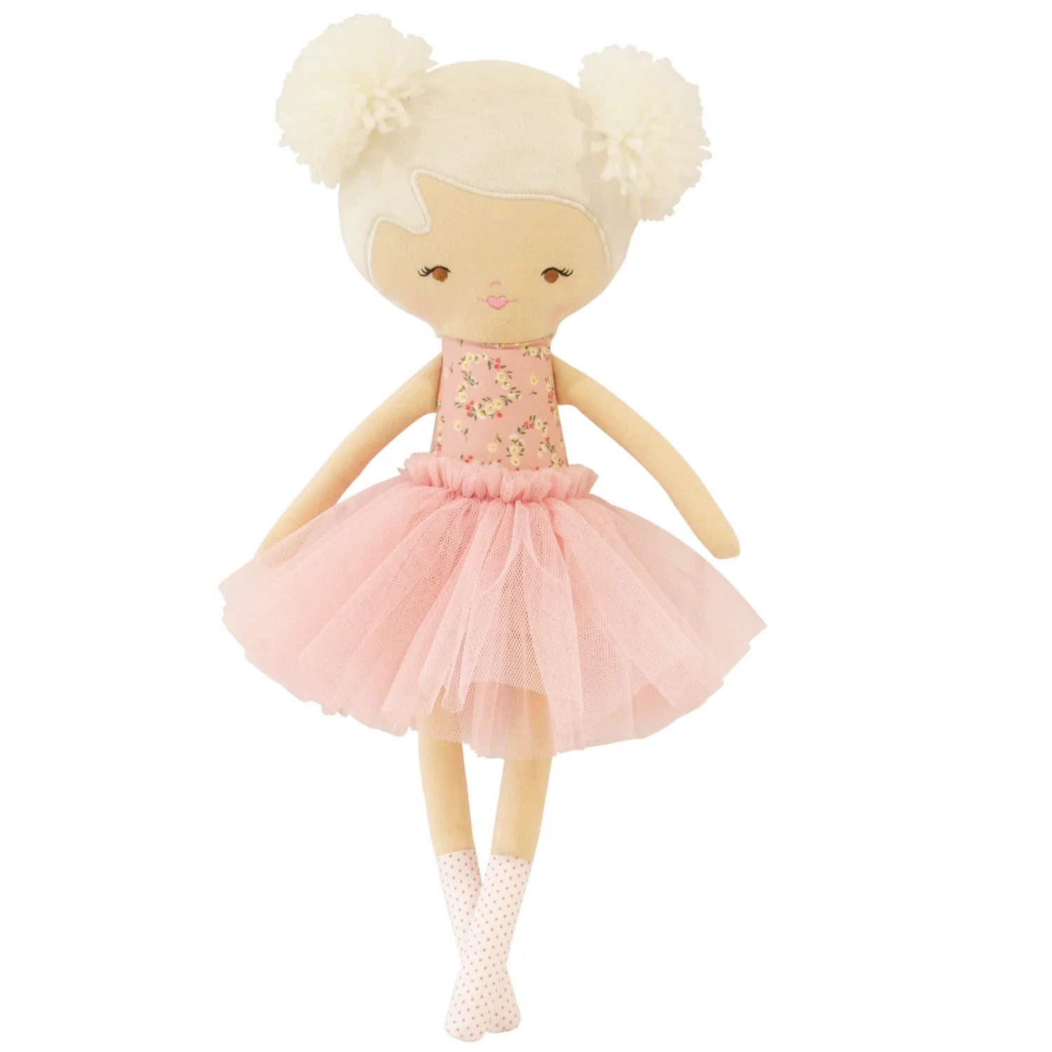 Doll with blonde hair in pigtails wearing a pink dress on a white background