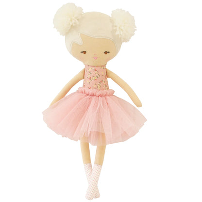 Doll with blonde hair in pigtails wearing a pink dress on a white background