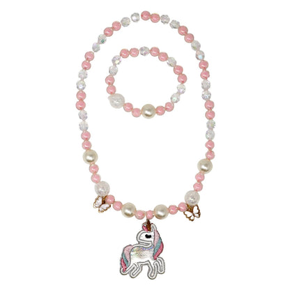 Necklace and bracelet set with pink and white beads and a unicorn charm on a white background