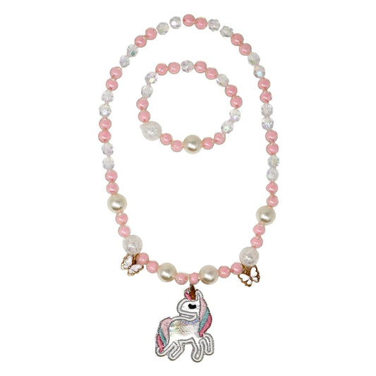 Necklace and bracelet set with pink and white beads and a unicorn charm on a white background