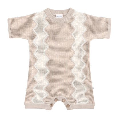 Knitted baby romper with zigzag pattern on a white background