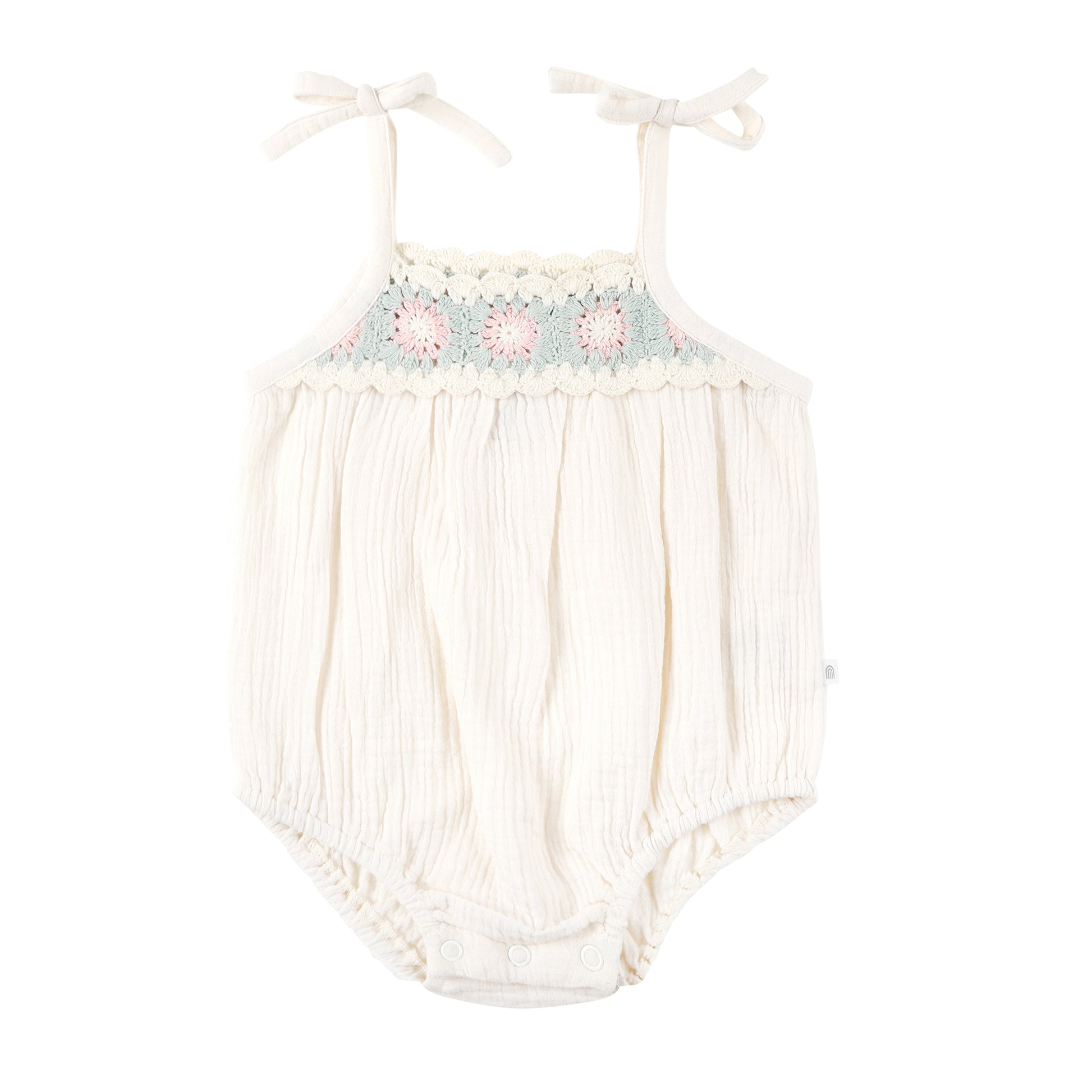 Baby romper with floral embroidery on a white background