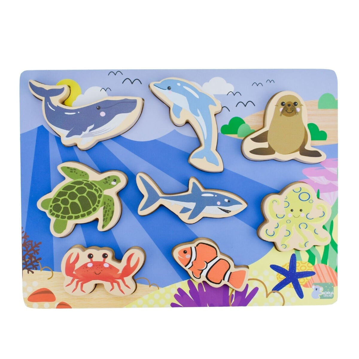 Set of ocean-themed wooden toys on a colorful background