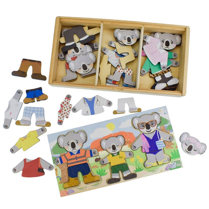 Wooden toy set with koala figures and clothing pieces on a white background