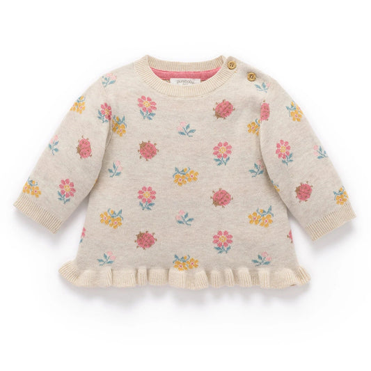 Baby sweater with floral pattern on a white background