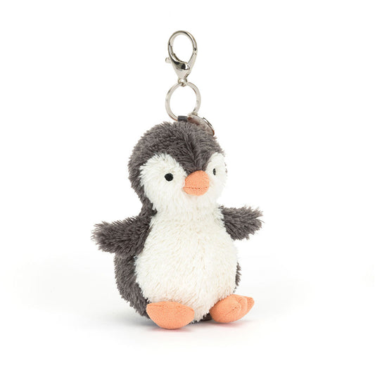 Plush penguin keychain on a white background
