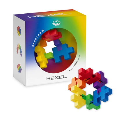 Hexel puzzle set with colorful interlocking pieces and its packaging on a white background