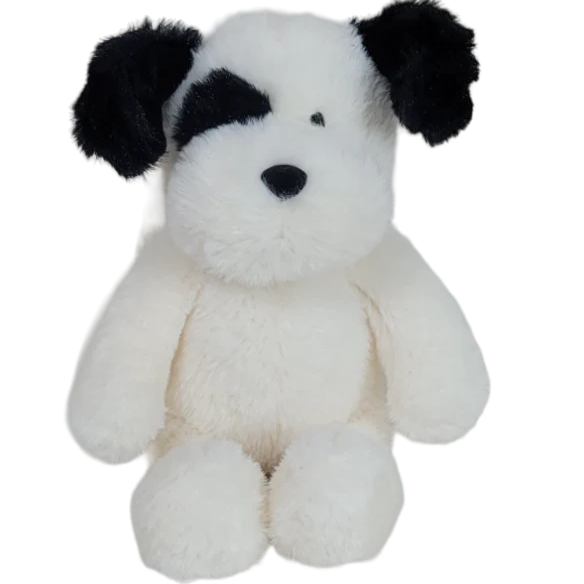 White plush dog toy with black ears on a white background