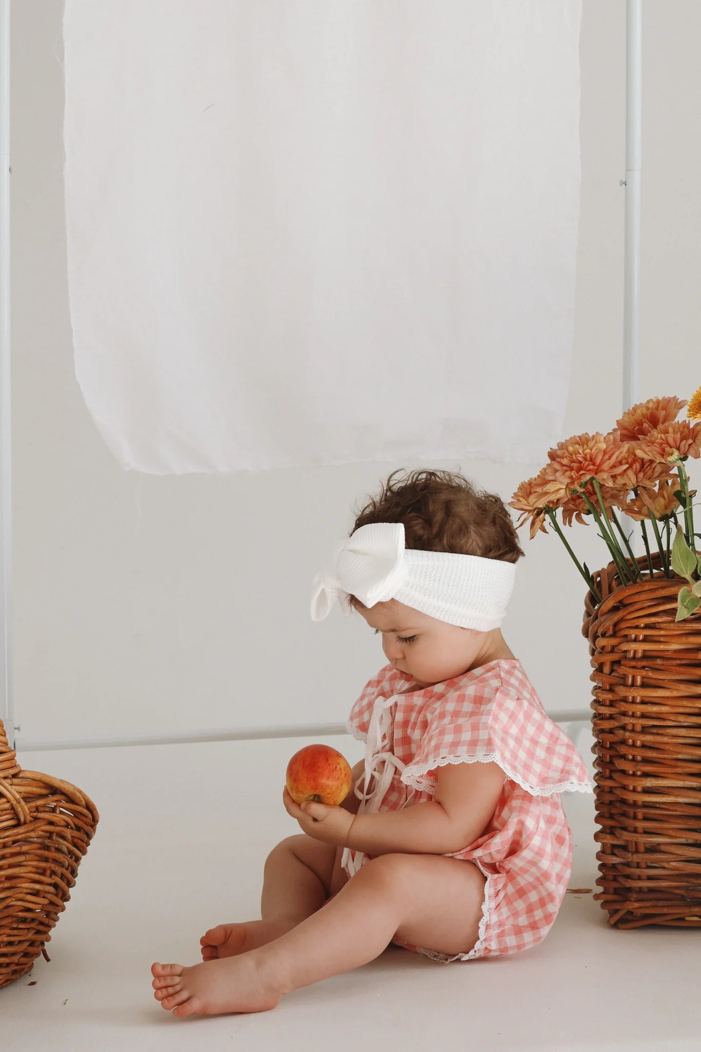 BLOSSOM AND PEAR DOROTHY FLUTTER SLEEVE ROMPER | PINK GINGHAM