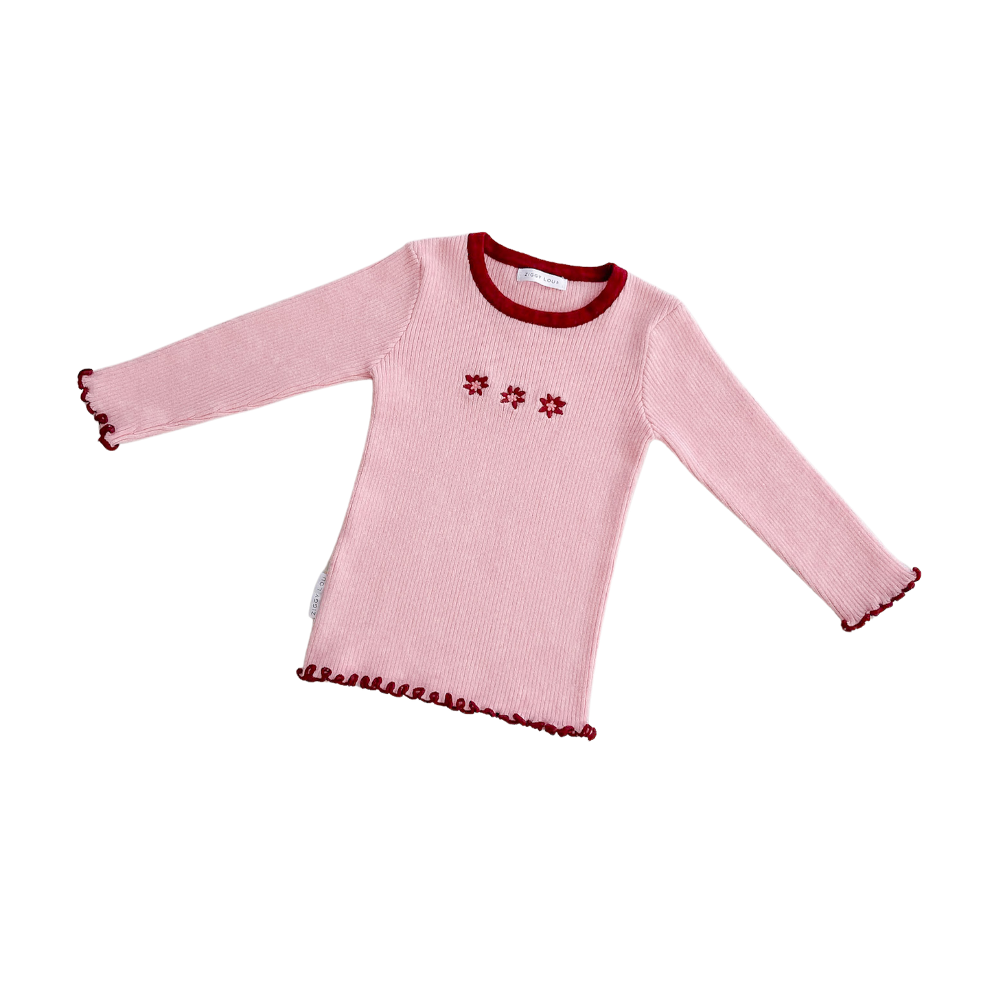 Pink long-sleeve shirt with red trim and floral patterns on a white background