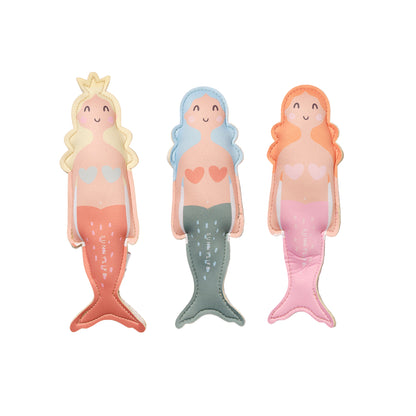 Three mermaid-shaped bookmarks with different colored hair and tails on a light gray background.