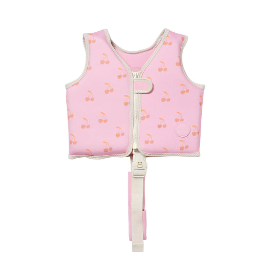 Pink children's life jacket with cherry pattern on a light gray background