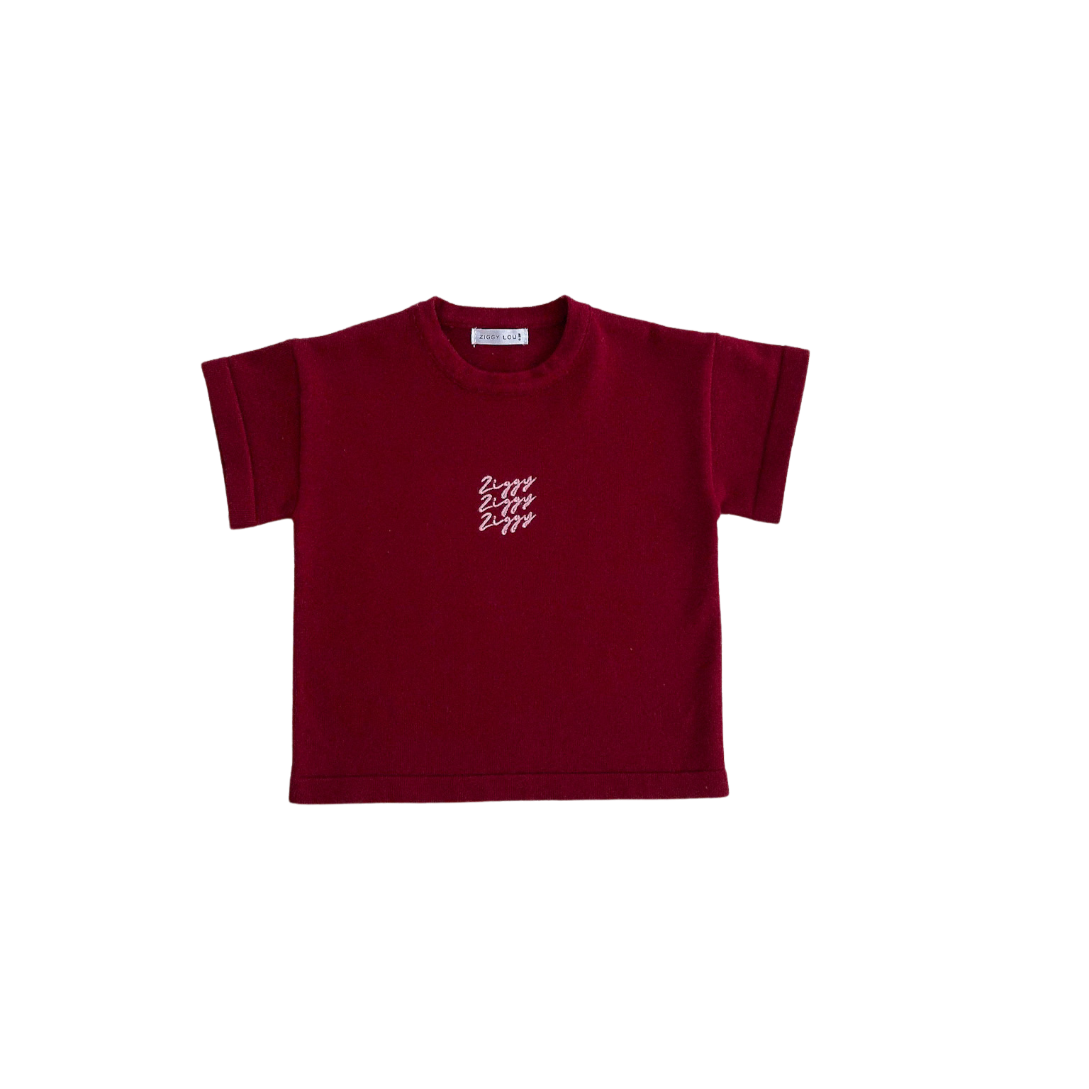 Maroon t-shirt with a small white logo on a white background