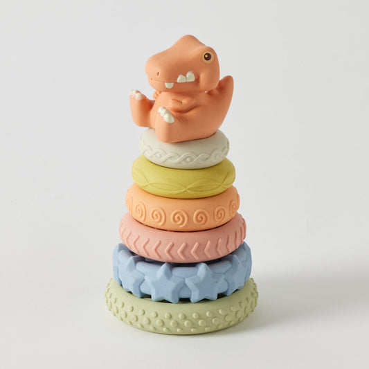 Stack of colorful dinosaur-shaped rings on a white background