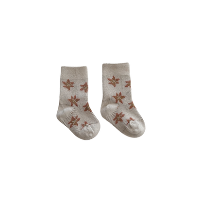 Pair of baby socks with star pattern on a white background