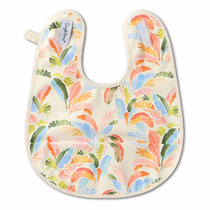 Baby bib with colorful toucan and leaf pattern on a white background