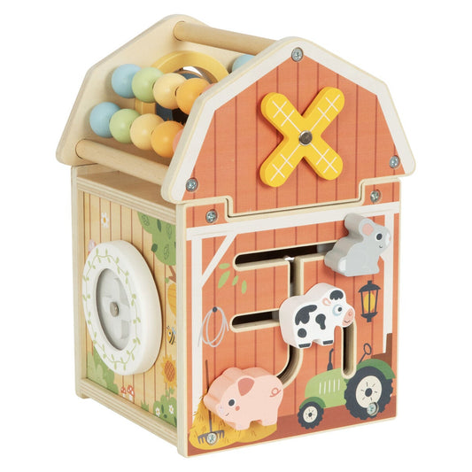 Wooden toy barn with various interactive elements on a white background