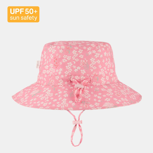 Pink floral sun hat with UPF 50+ label on a white background