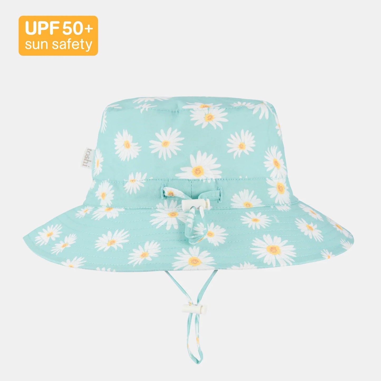 Light blue sun hat with white daisy pattern on a white background