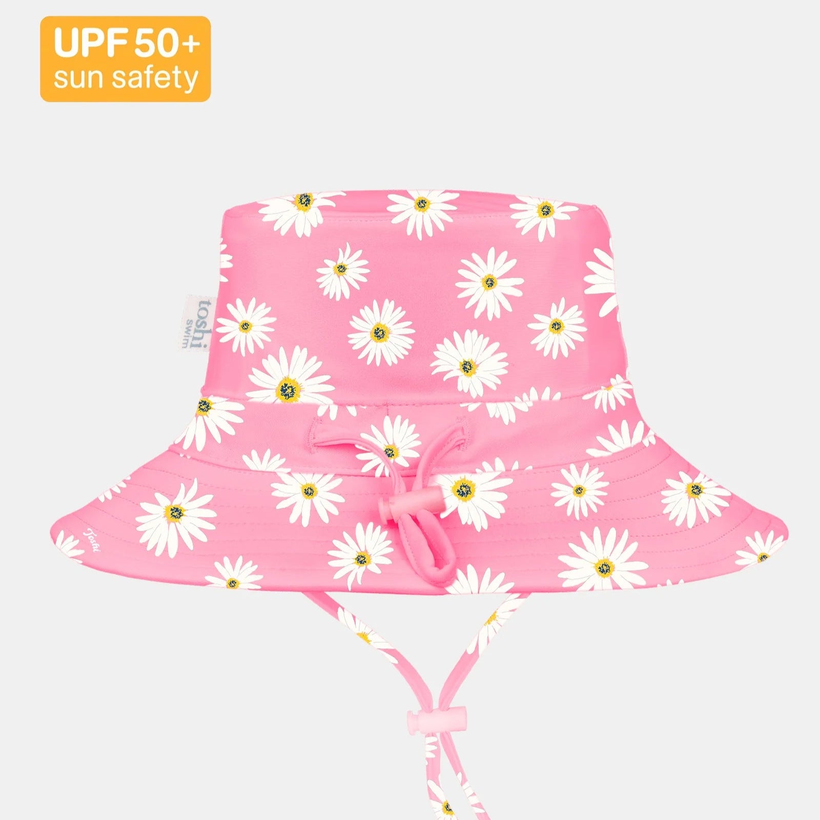 Pink sun hat with daisy pattern on a white background